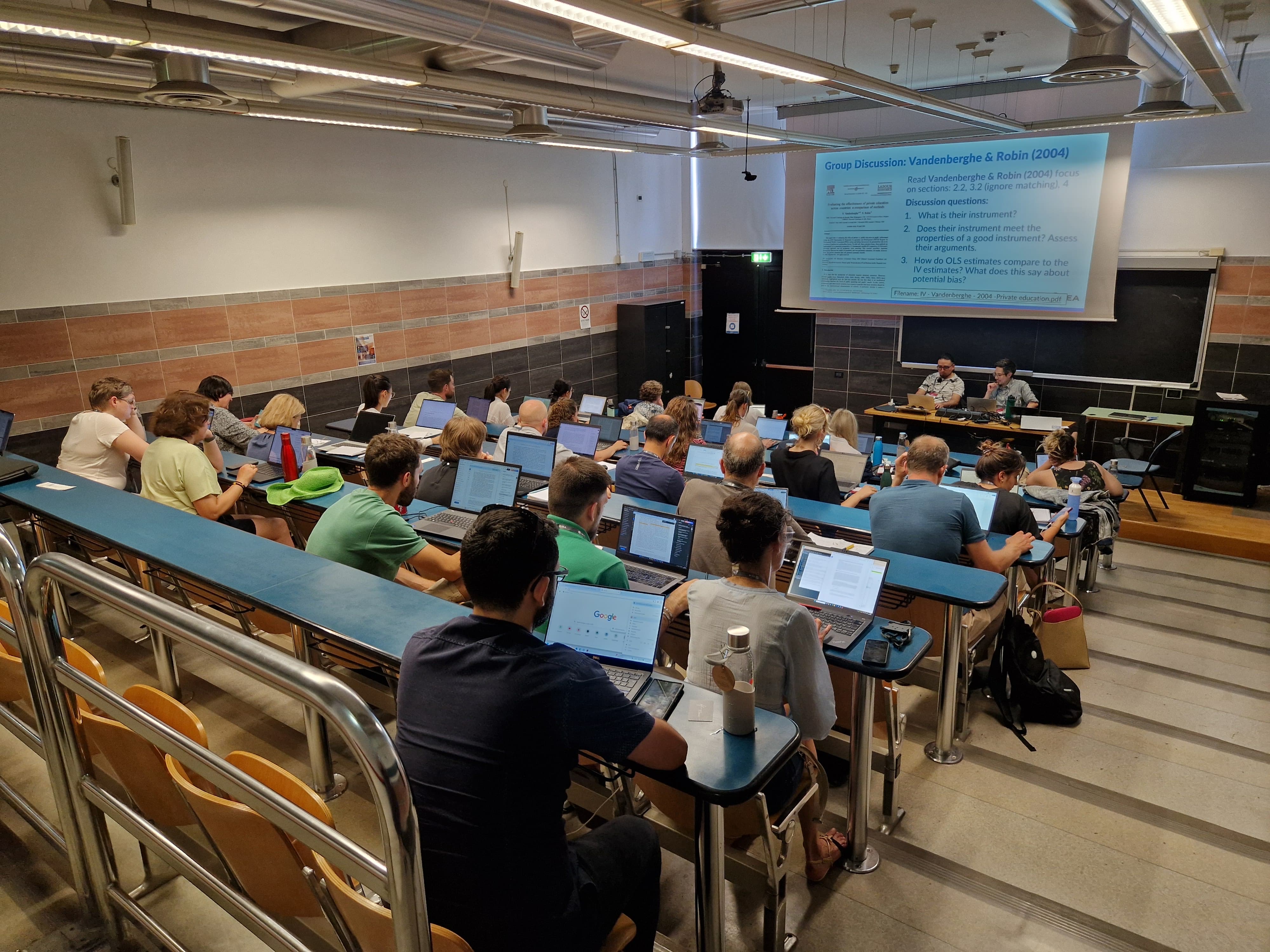 Workshop audience and leaders sitting in a lecture hall