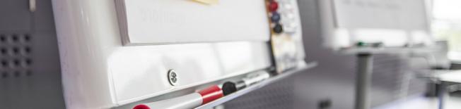 Image of a flip chart and pens